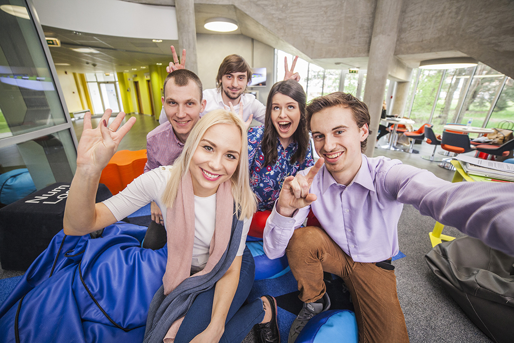 A group of five students cheering about the EuroTeQ Campus